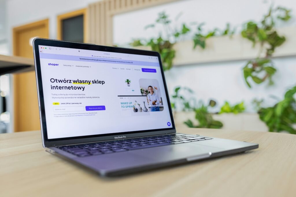 User creating email marketing campaign on laptop using software tools