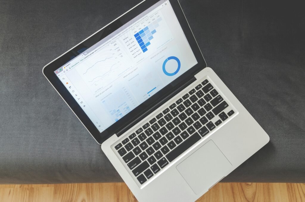 Laptop displaying business analytics dashboard used for monitoring online business